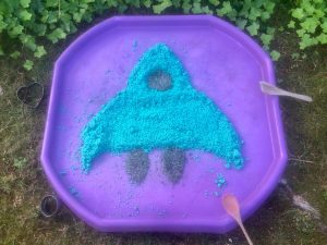 Messy play materials in the shape of a rocket